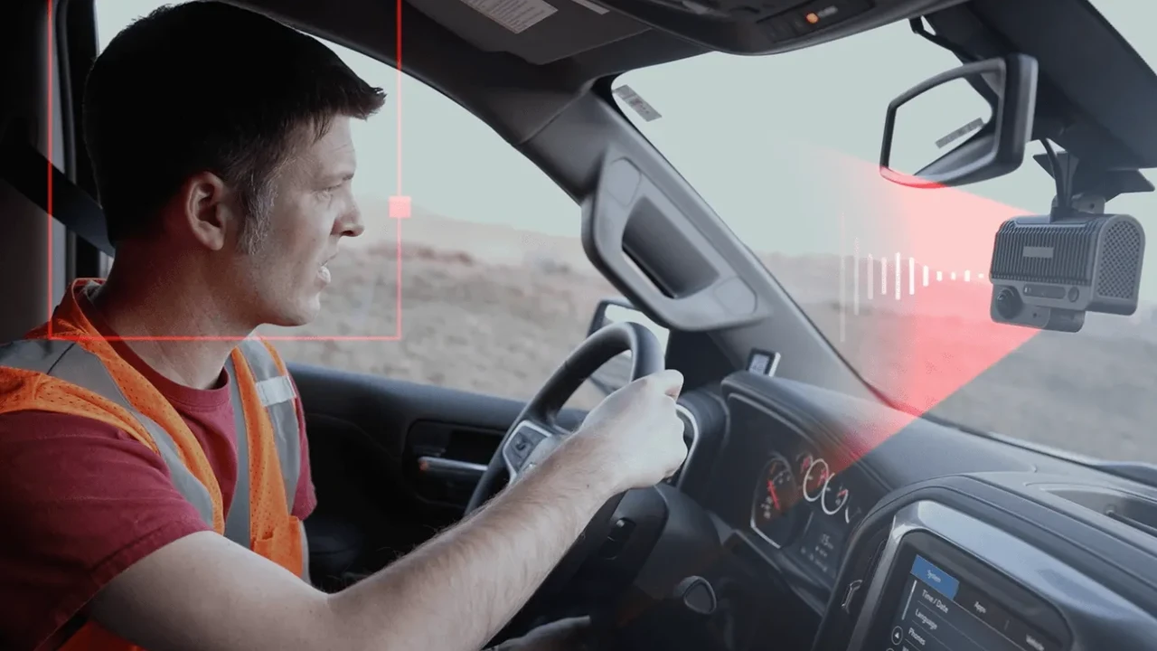 Two mint chocolate milkshakes with whipped cream and green sprinkles.